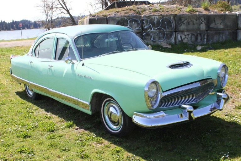 A Dealership Purchased A Four Door Sedan