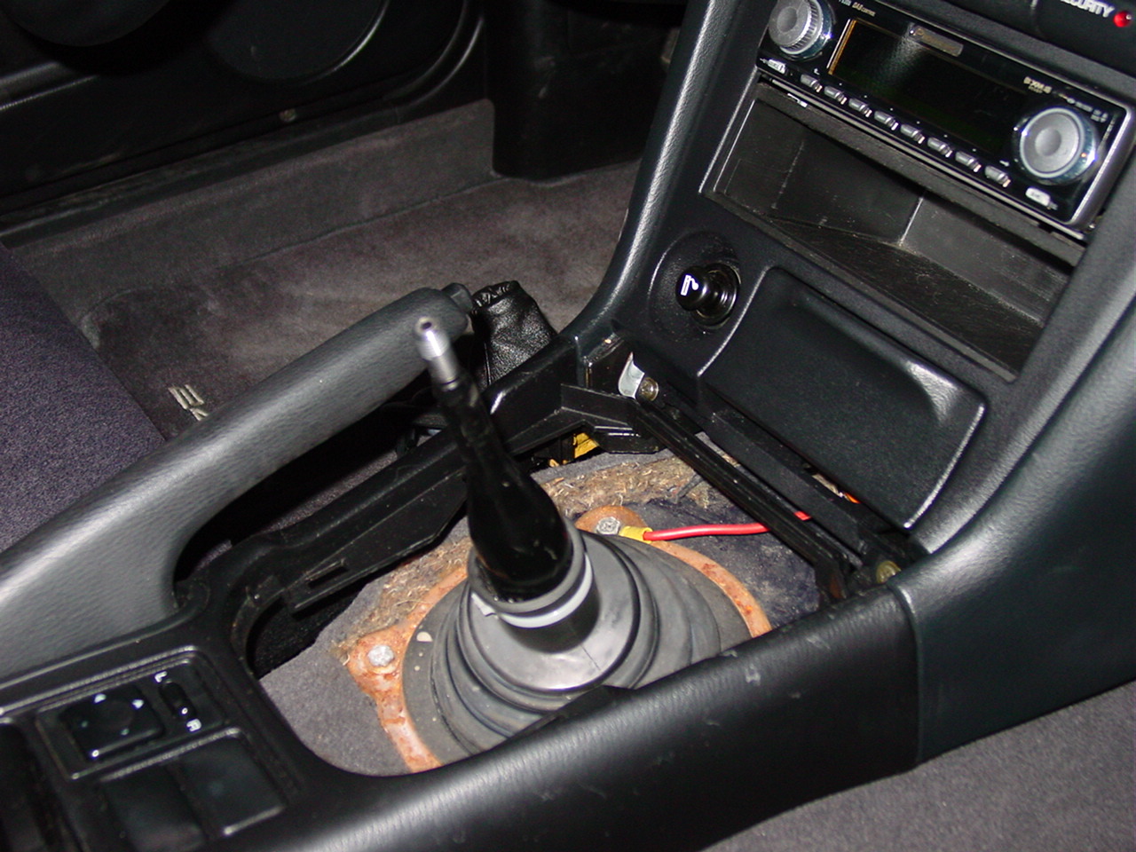 Replacement Of The Center Console Shifter Trim Panel On A 240sx
